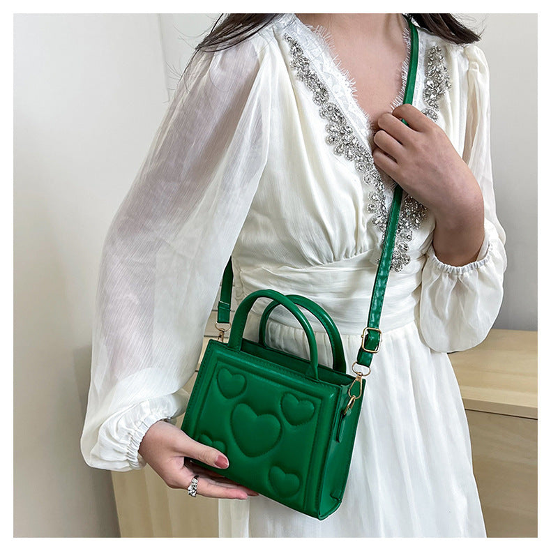 1pc Women’s Stylish Solid Color Handbag with Detachable Strap – Heart Pattern Design, Perfect for Valentine’s Day Gift, Available in Magenta, White, Black, Green, Yellow